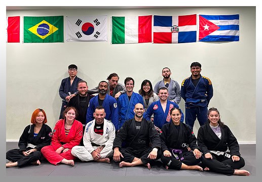 Martial arts class at Johnny Karate NYC with diverse students and international flags.