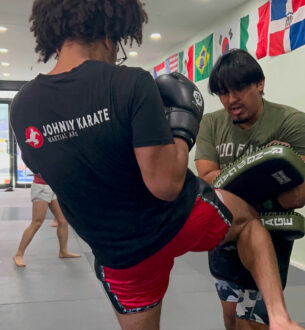 Adult martial arts class at Johnny Karate NYC focusing on self-defense and fitness.