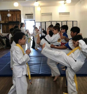 Martial arts class for kids at Johnny Karate NYC, promoting discipline and confidence after school.