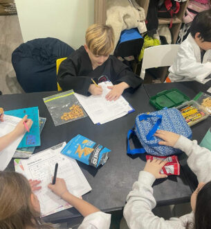 Johnny Karate NYC students engaged in after-school learning activities.