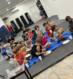 Children participating in martial arts class at Johnny Karate NYC.