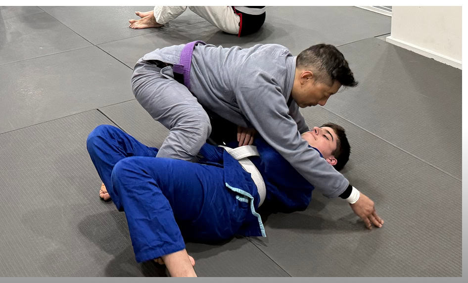 Teen BJJ students practicing Brazilian Jiu-Jitsu techniques at Johnny Karate NYC.