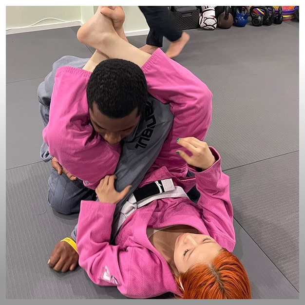 Young athletes practicing Brazilian Jiu-Jitsu techniques.