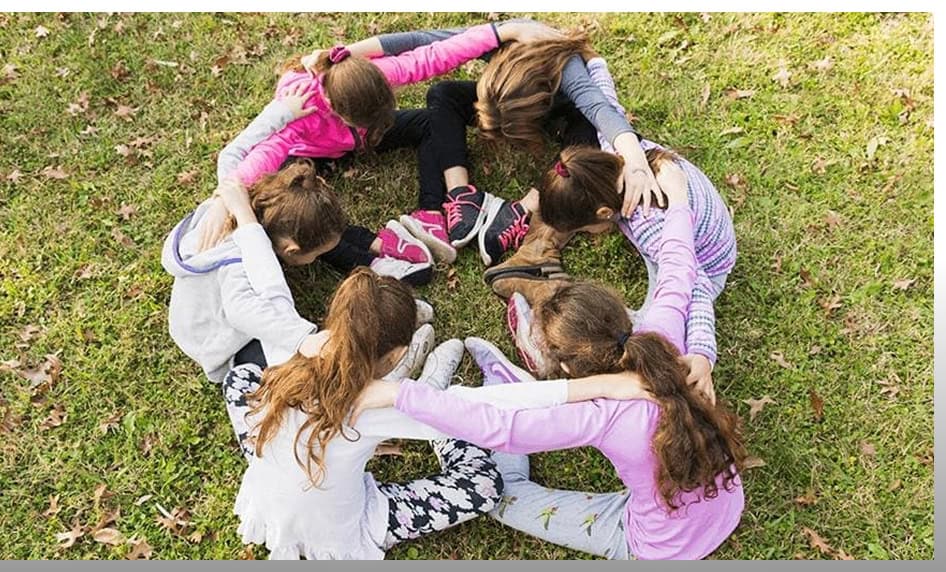 Children playing in a circle during after school program at Johnny Karate NYC.