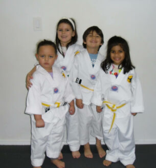 Kids practicing martial arts in preschool class at Johnny Karate NYC.