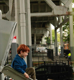 Johnny Karate NYC enjoying summer camp activities near subway infrastructure.