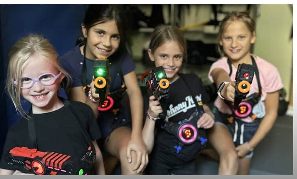 Kids having fun with laser tag at Johnny Karate NYC birthday celebration.
