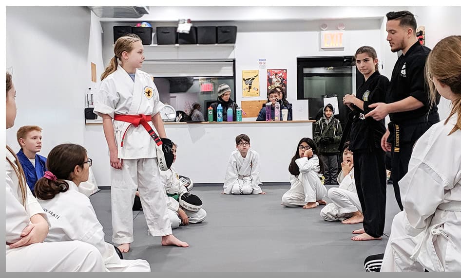 Young girl demonstrating martial arts techniques during a class at Johnny Karate NYC.